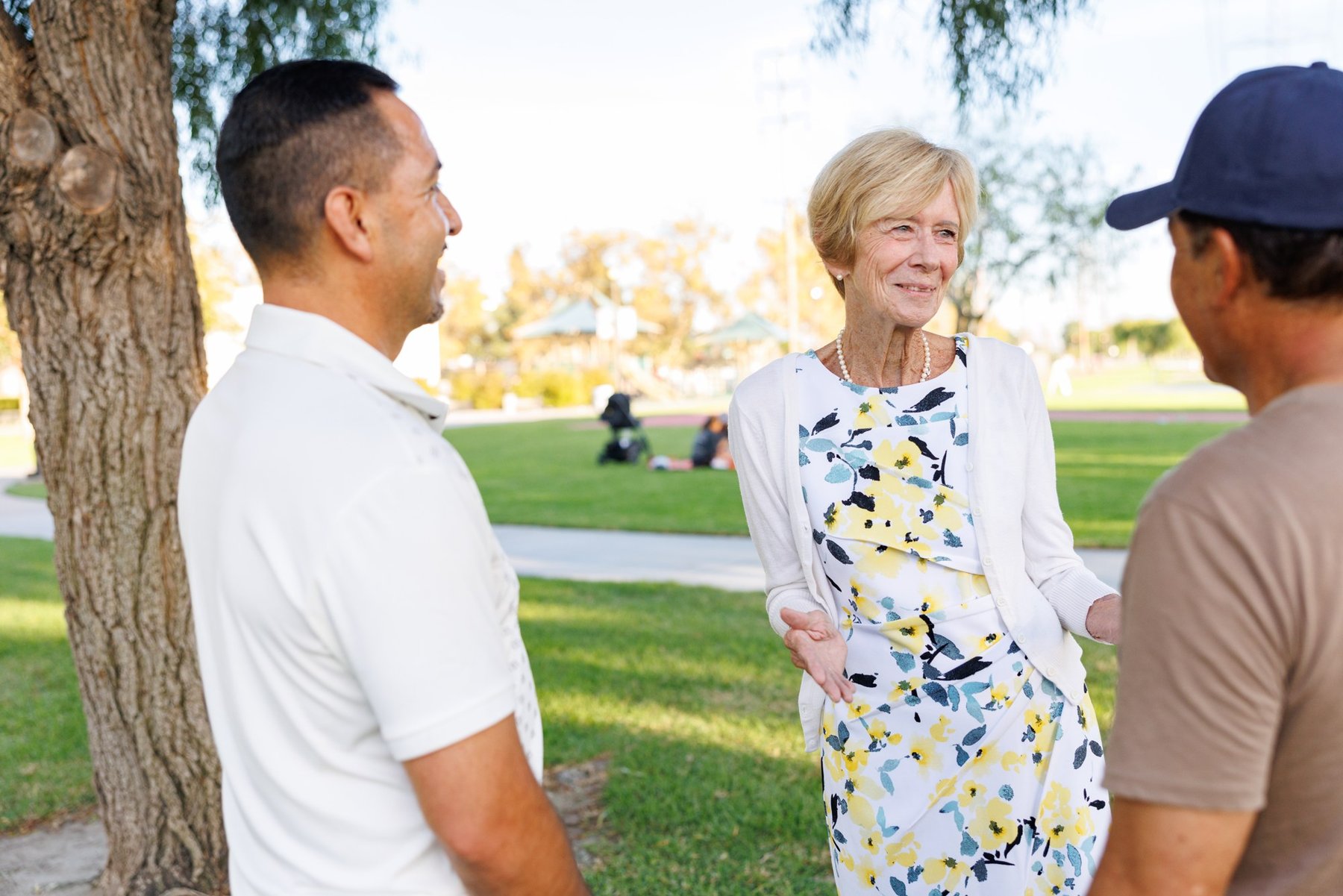 Jeanie McHatton talking with neighbors at a park